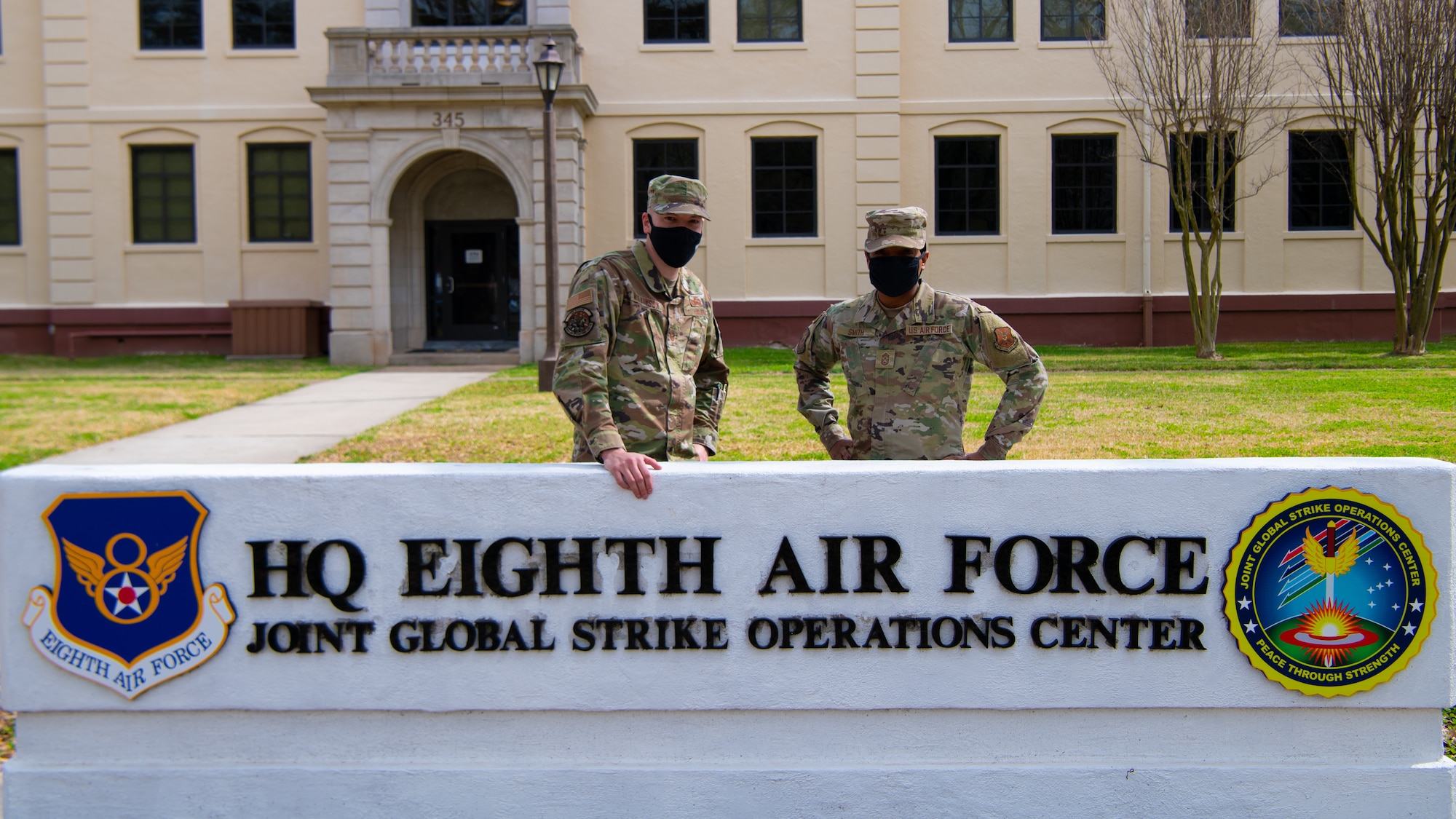 Chief Master Sgt. Melvina Smith, 8th Air Force command chief and Joint Global Strike Operations Center senior enlisted leader (right), and Tech Sgt. Adam Wilkinson, 8th Air Force and Joint Global Strike Operations Center deputy chief of nuclear command, control and communication threats (left) pose for a photo outside of the 8th Air Force headquarters building at Barksdale Air Force base, La., Feb. 23, 2021. Tech Sgt. Wilkinson had the opportunity to shadow Chief Smith for a day.  (U.S. Air Force photo by Staff Sgt. Bria Hughes)