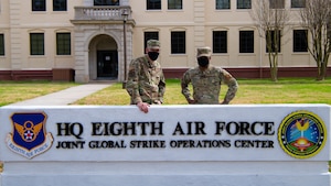 Chief Master Sgt. Melvina Smith, 8th Air Force command chief and Joint Global Strike Operations Center senior enlisted leader (right), and Tech Sgt. Adam Wilkinson, 8th Air Force and Joint Global Strike Operations Center deputy chief of nuclear command, control and communication threats (left) pose for a photo outside of the 8th Air Force headquarters building at Barksdale Air Force base, La., Feb. 23, 2021. Tech Sgt. Wilkinson had the opportunity to shadow Chief Smith for a day.  (U.S. Air Force photo by Staff Sgt. Bria Hughes)