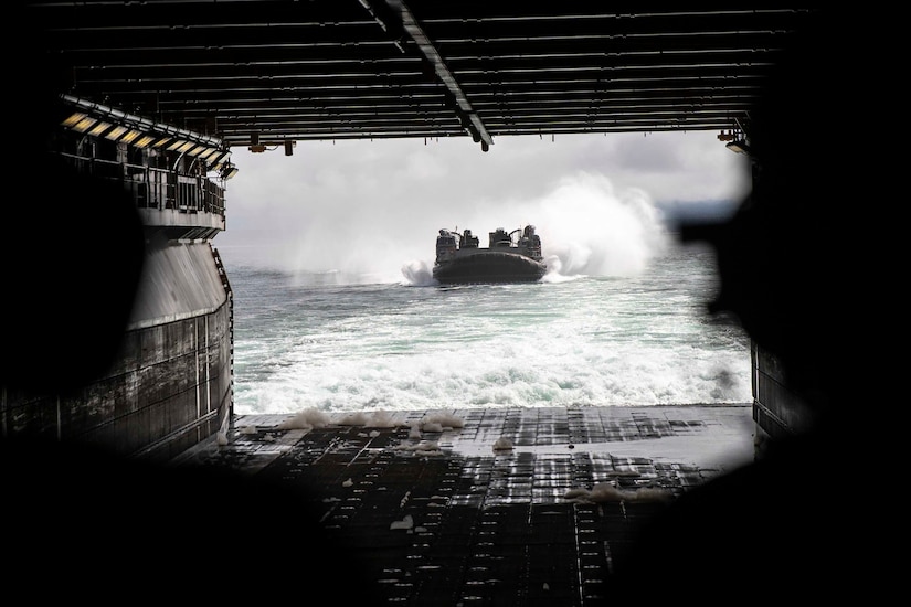 A landing craft takes to the water.
