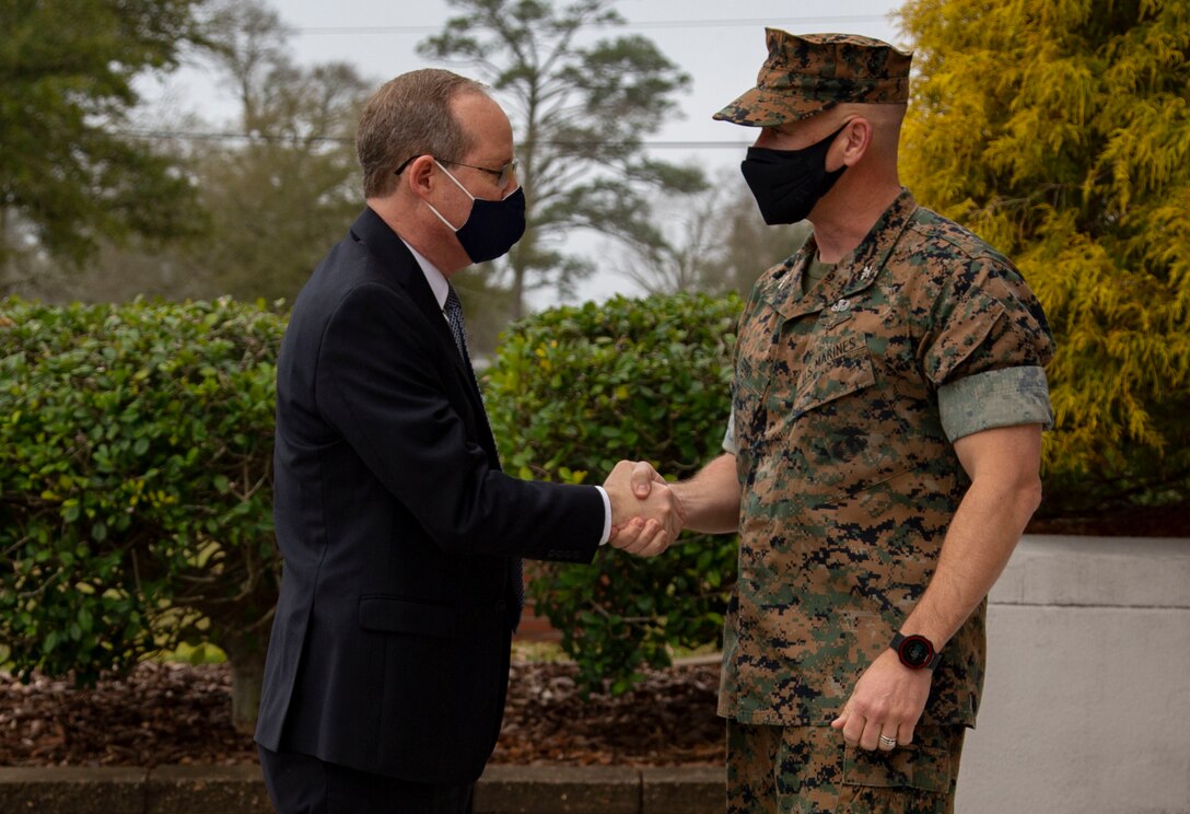 U.S. Marine Corps Col. Todd W. Ferry, right, deputy commander, Marine Corps Installations East-Marine Corps Base Camp Lejeune, greets Congressman Gregory F. Murphy, left, North Carolina’s third district representative, at the John A. Lejeune Hall on MCB Camp Lejeune, North Carolina, March 23, 2021. During his visit, Murphy met with MCB Camp Lejeune leaders to receive updates on range innovations and base modernization. (U.S. Marine Corps photo by Cpl. Ginnie Lee)