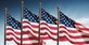 American flags against a blue sky background