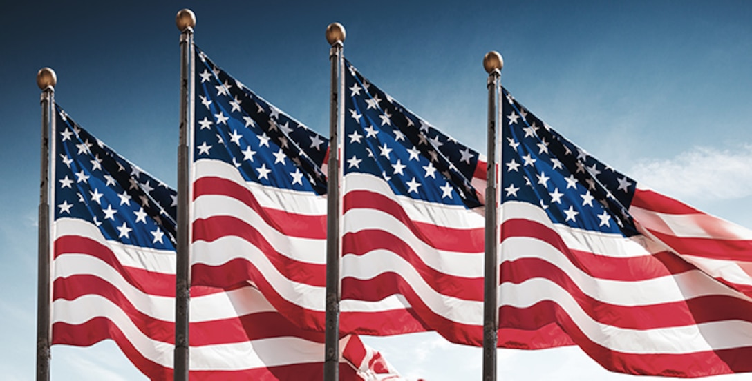 American flags against a blue sky background