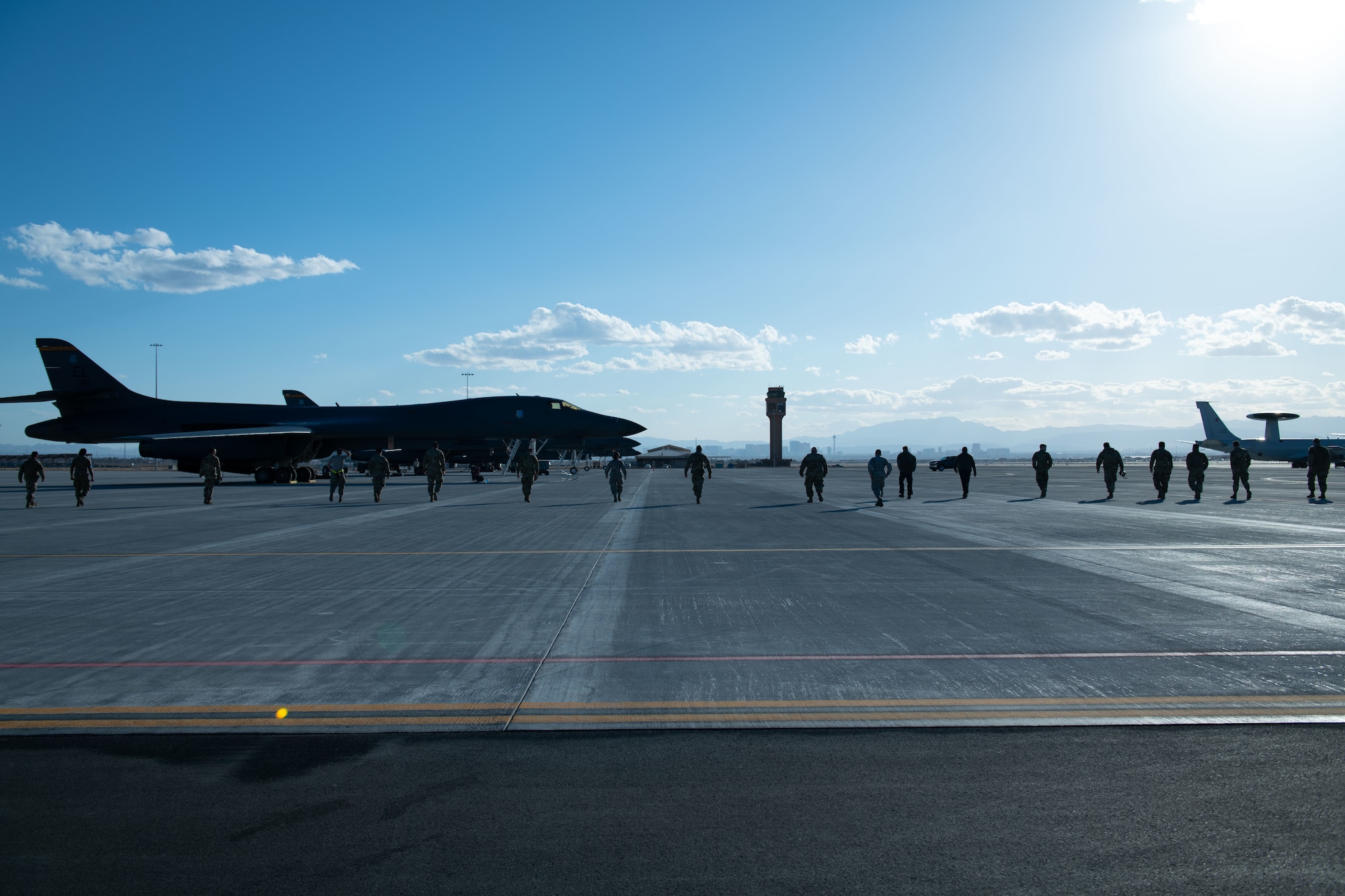 Airmen from the 28th Aircraft Maintenance Squadron perform a foreign object debris (FOD) check along the flight line during Red Flag 21-2 at Nellis Air Force Base, Nev., March 9, 2021.