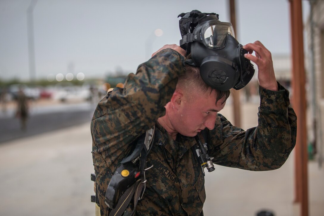 U.S. Marines with Headquarters and Headquarters Squadron (H&HS), run through a fireman training obstacle course in Yuma, Ariz., Sep. 11, 2020. The obstacle course training event was created and ran as part of a squadron memorial honoring the events of 9/11. (U.S. Marine Corps photo by Lance Cpl. John Hall)