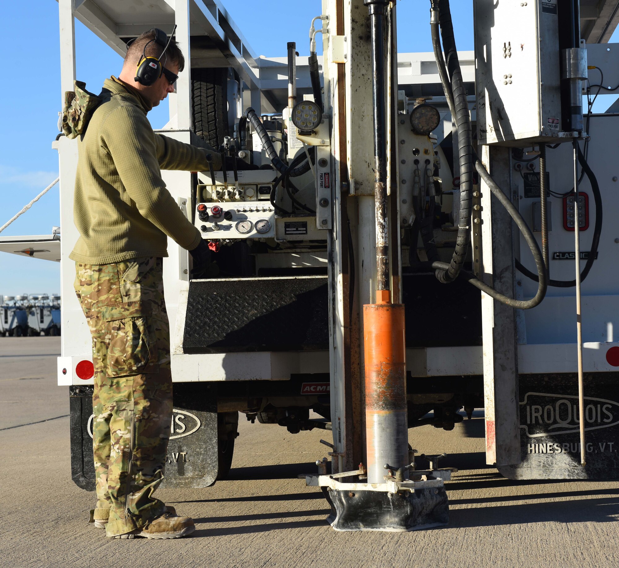 A picture of a man at drill controls