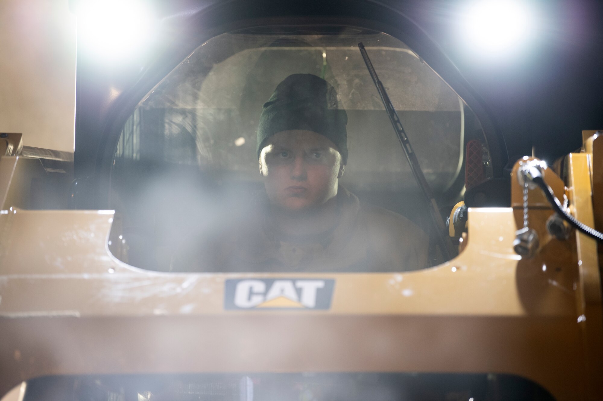 U.S. Air Force Airman 1st Class Clyde Wensing, 52nd Civil Engineer Squadron’s Rapid Airfield Damage Recovery team member, operates compact tracked loader during runway repair operations as part of the AGILE SABRE exercise on Spangdahlem Air Base, Germany, March 23, 2021.
