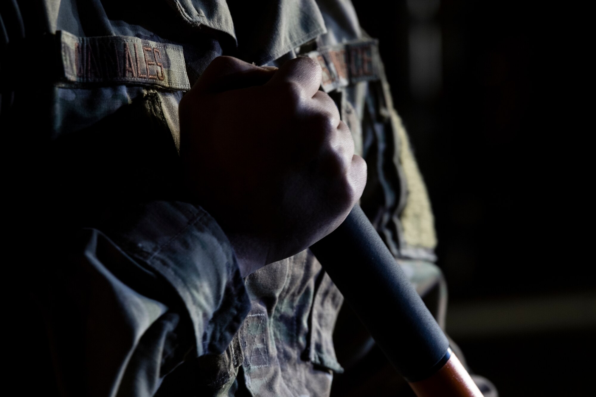A U.S. Air Force Airman from the 52nd Civil Engineer Squadron’s Rapid Airfield Damage Recovery team holds onto his shovel during runway repair operations as part of the AGILE SABRE exercise on Spangdahlem Air Base, Germany, March 23, 2021.