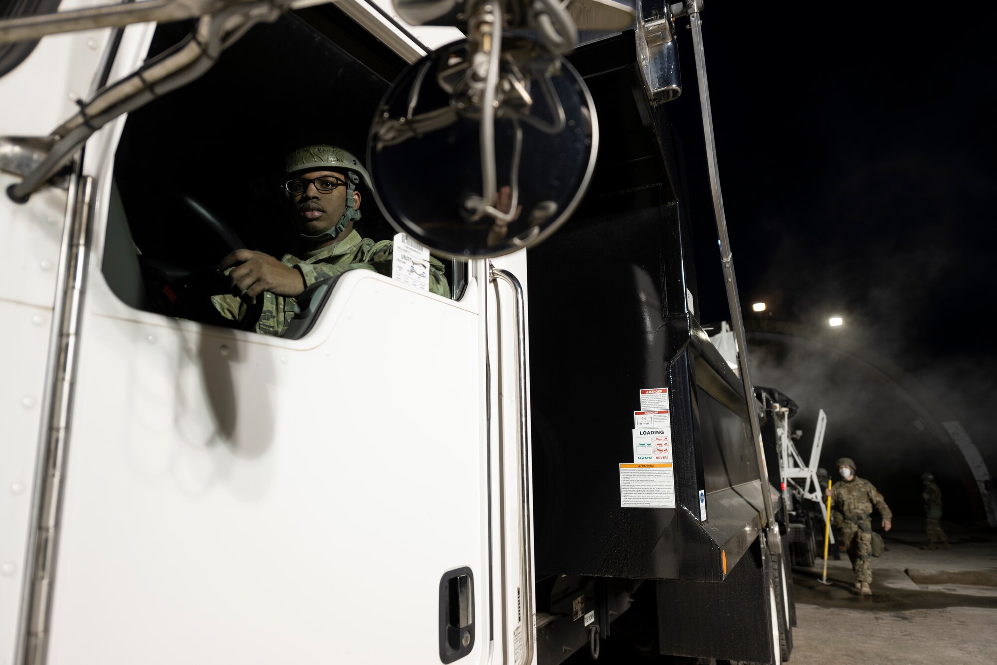 U.S. Air Force Airman 1st Class Devon’Trae Bailey, 52nd Civil Engineer Squadron Rapid Airfield Damage Recovery team member, waits to deliver repair supplies to his RADR team members during runway repair operations as part of the AGILE SABRE exercise on Spangdahlem Air Base, Germany, March 23, 2021.