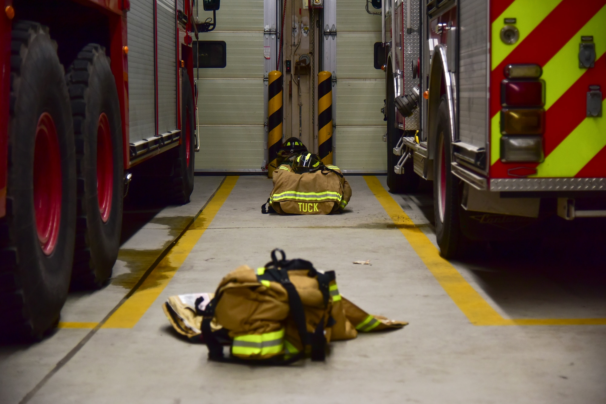 Gear sits inside the Fire Department at Kunsan Air Base, Republic of Korea, March 23, 2021. Firefighters respond to emergencies from brush fires to burning rocket fuel and hazardous material fires to ensure the safety of others. (U.S. Air Force photo by Senior Airman Suzie Plotnikov)