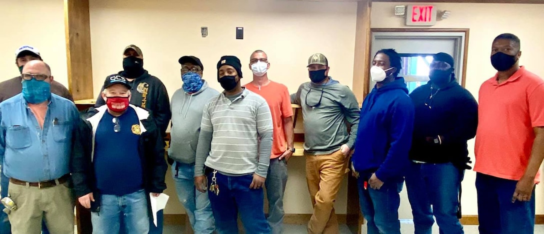 IN THE PHOTO, a team of mechanics, electricians, carpenters, pipefitters, HVAC technicians, and revetment workers all got together to completely renovate the Tractor Shop’s breakroom, literally from the ground up.