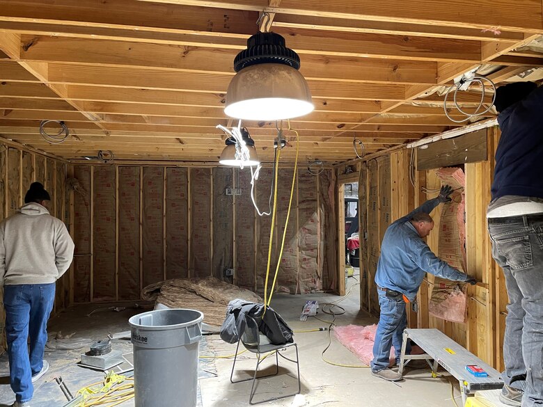 IN THE PHOTO, a team of mechanics, electricians, carpenters, pipefitters, HVAC technicians, and revetment workers all got together to completely renovate the Tractor Shop’s breakroom, literally from the ground up.