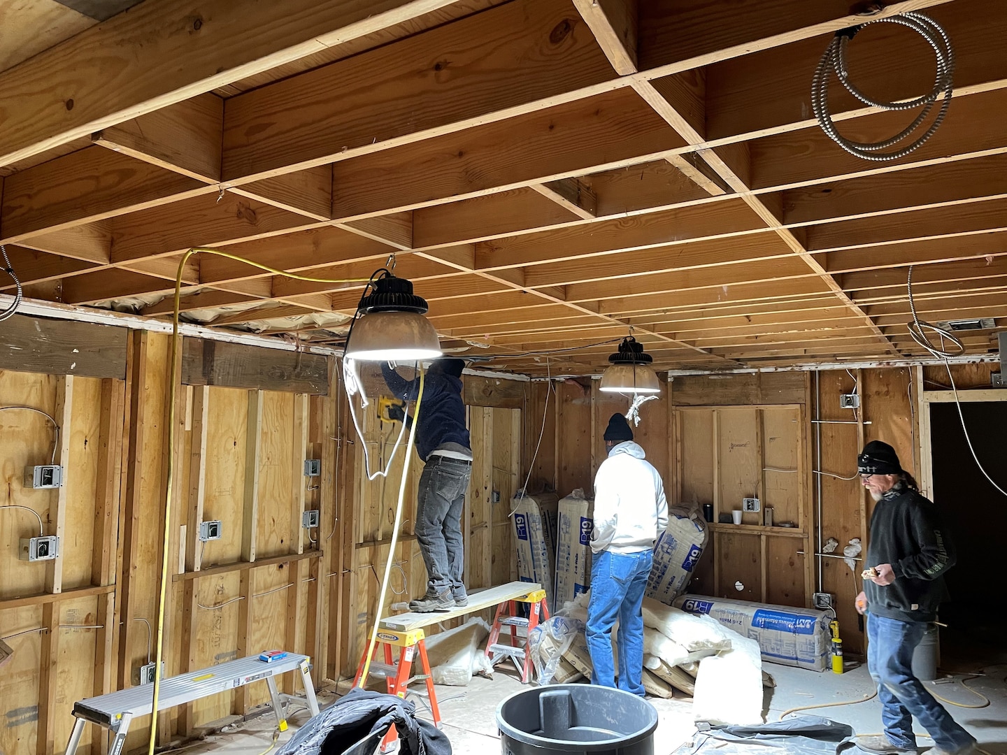 IN THE PHOTO, a team of mechanics, electricians, carpenters, pipefitters, HVAC technicians, and revetment workers all got together to completely renovate the Tractor Shop’s breakroom, literally from the ground up.