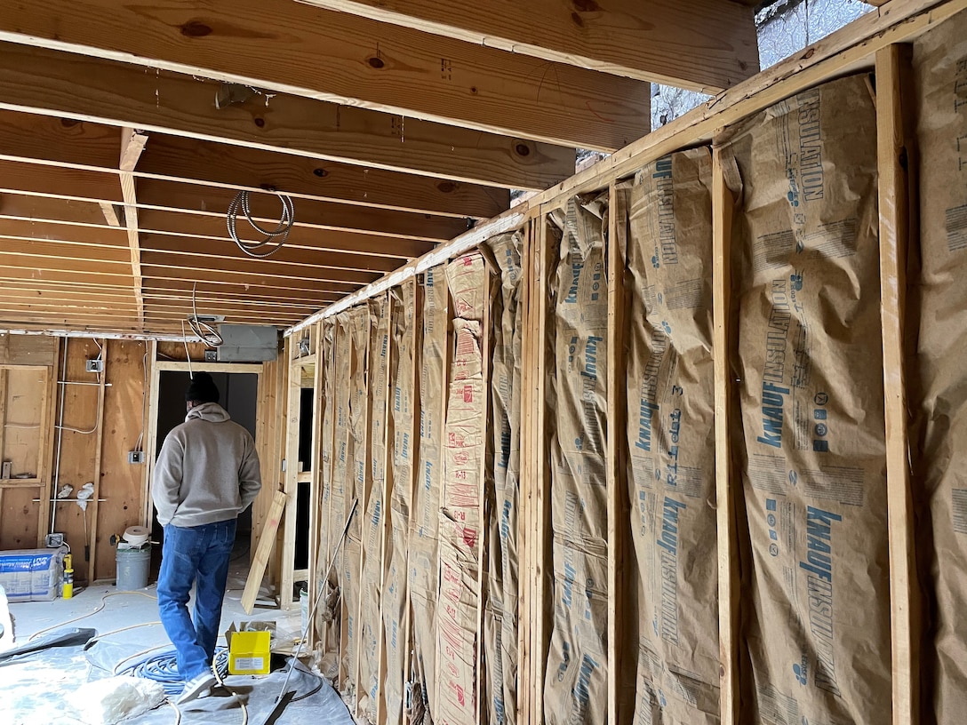 IN THE PHOTO, a team of mechanics, electricians, carpenters, pipefitters, HVAC technicians, and revetment workers all got together to completely renovate the Tractor Shop’s breakroom, literally from the ground up.