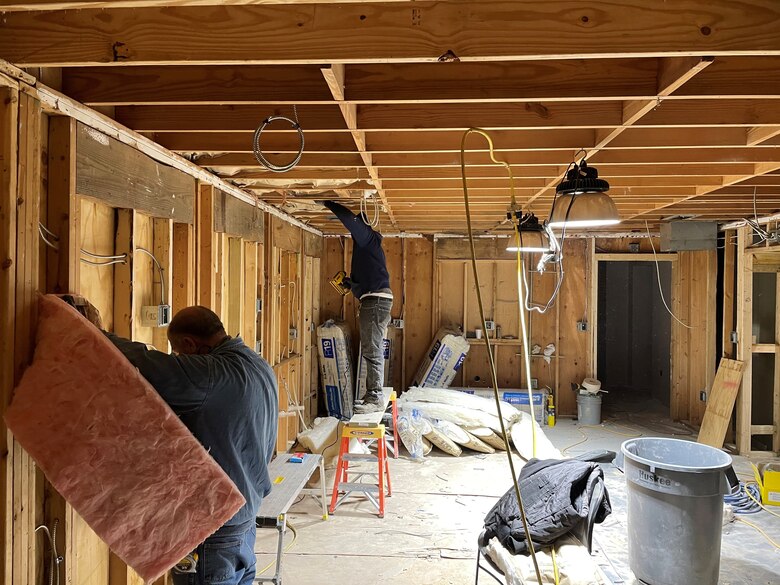 IN THE PHOTO, a team of mechanics, electricians, carpenters, pipefitters, HVAC technicians, and revetment workers all got together to completely renovate the Tractor Shop’s breakroom, literally from the ground up.