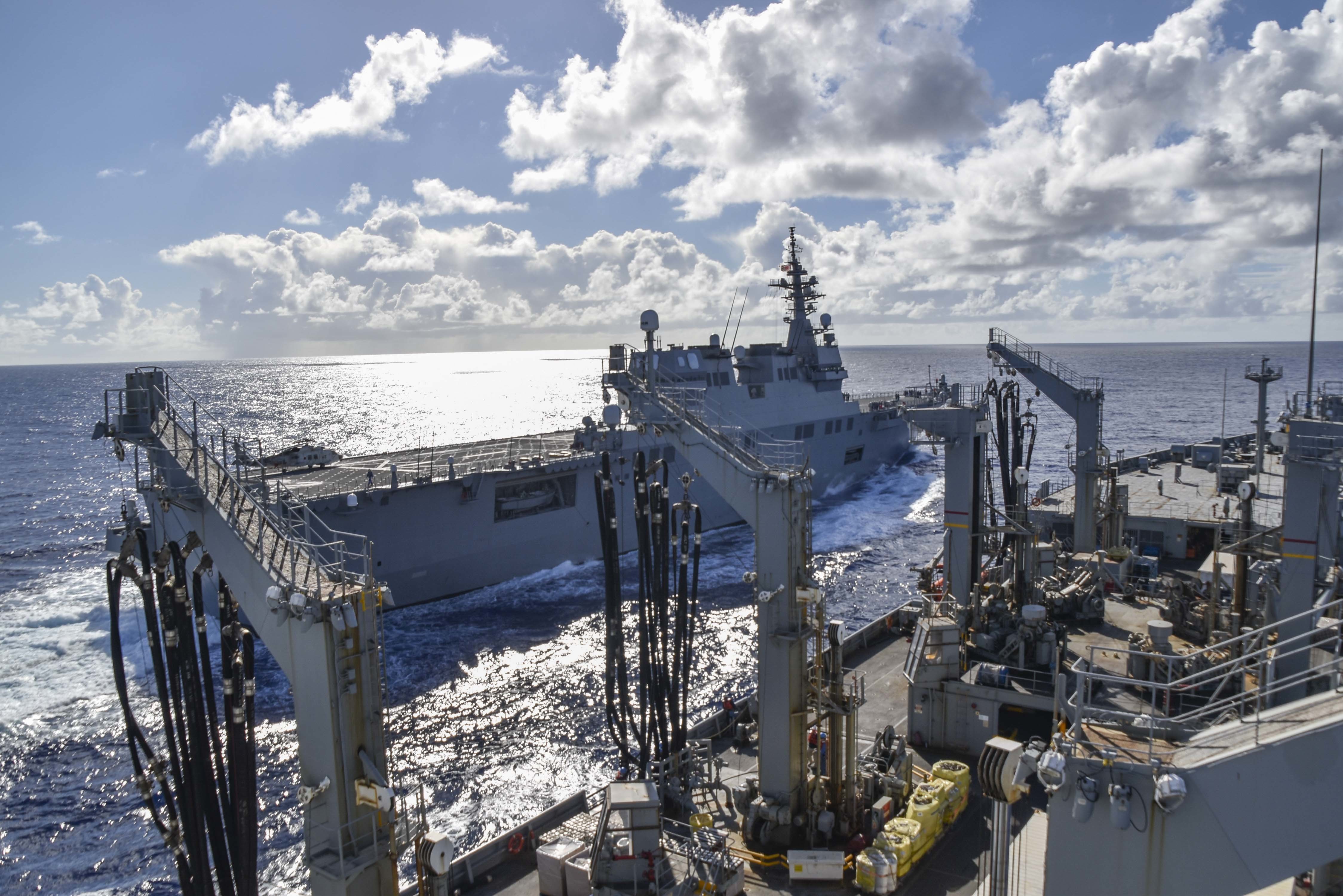 The Henry J. Kaiser-class underway replenishment oiler USNS John Ericsson (T-AO 194) provides supplies to the Japan Maritime Self-Defense Force helicopter destroyer JS Ise (DH 182).