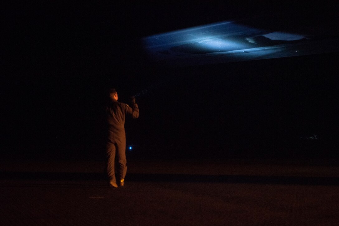 A pilot assigned to the 9th Expeditionary Bomb Squadron conducts a structure check on a B-1B Lancer upon landing at Ørland Air Force Station, Norway, March 19, 2021. Aircraft routinely undergo general structural inspections to ensure the plane hasn’t sustained any exterior impairments. (U.S. Air Force photo by Airman 1st Class Colin Hollowell)