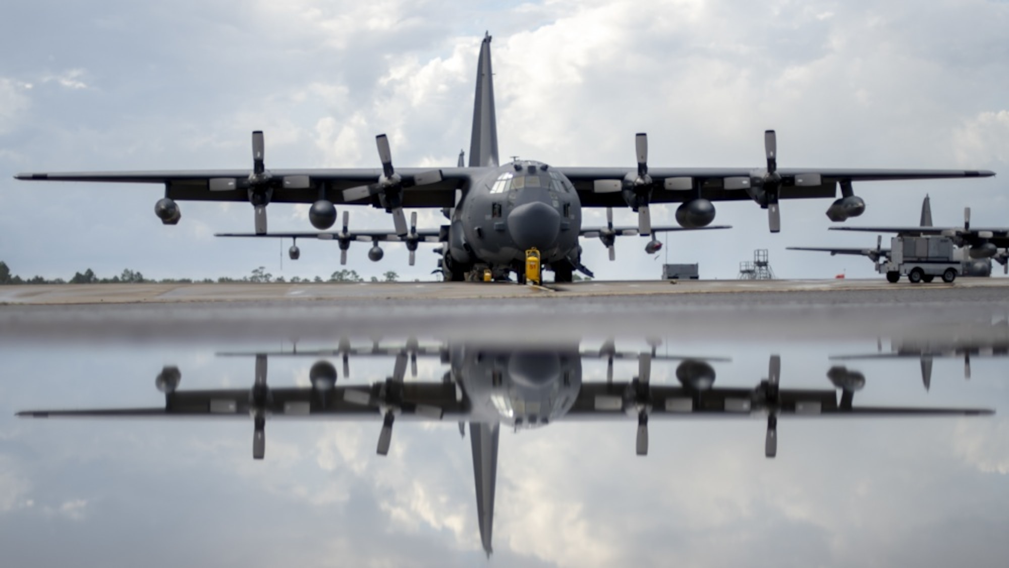An MC-130H Combat Talon II assigned to the 15th Special Operations Squadron sits on the flightline after a morning rainstorm at Hurlburt Field, Fla., Aug. 21, 2018. The MC-130H is used for infiltration, exfiltration and resupply in contested or denied areas, and is capable of flying at altitudes as low as a few hundred feet above the ground through inclement and low-visibility weather conditions. (U.S. Air Force photo by Staff Sgt. Victor J. Caputo)