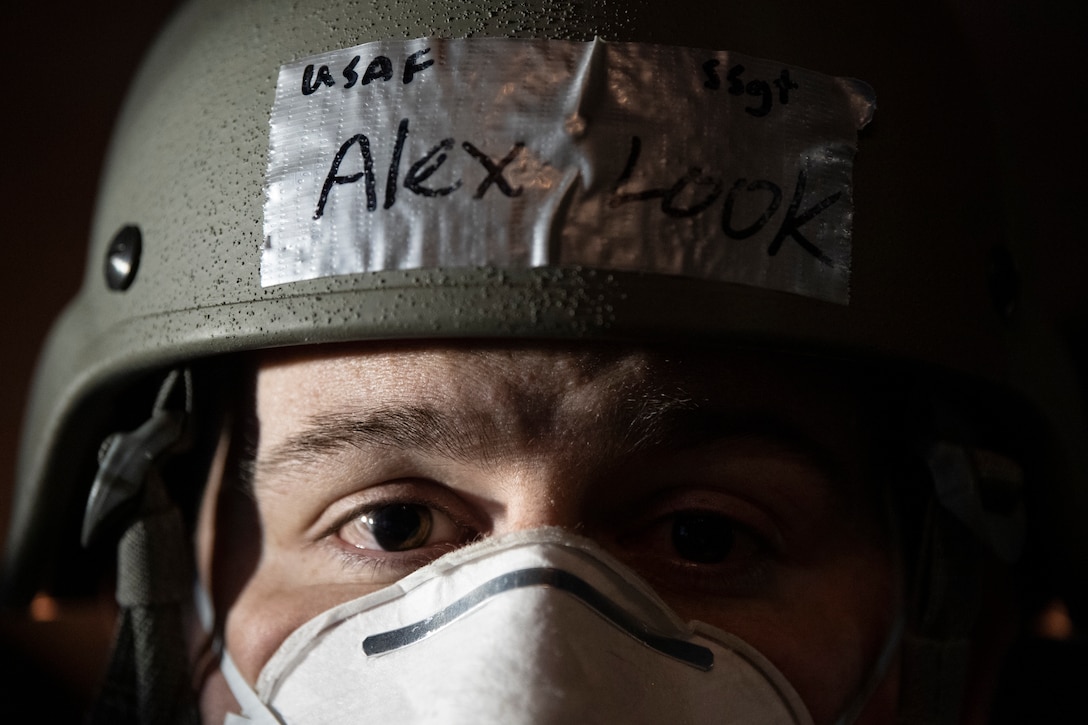 U.S. Air Force Staff Sgt. Alex Look, 52nd Civil Engineer Squadron Rapid Airfield Damage Recovery team member, waits to deliver repair supplies to his RADR team members during runway repair operations as part of the AGILE SABRE exercise on Spangdahlem Air Base, Germany, March 23, 2021.