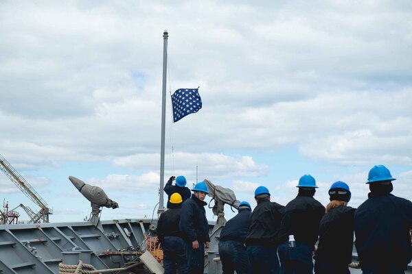 210323-N-WQ732-1063 CONSTANTA, Romania (March 23, 2021) Sailors lower the Union Jack flag and pull mooring lines aboard as the Ticonderoga-class guided-missile cruiser USS Monterey (CG 61), prepares to depart from Constanta, Romania, March 23, 2021.  Monterey is operating with the IKE Carrier Strike Group on a routine deployment in the U.S. Sixth Fleet area of operations in support of U.S. national interests and security in Europe and Africa. (U.S. Navy photo by Mass Communication Specialist Seaman Chelsea Palmer/Released)