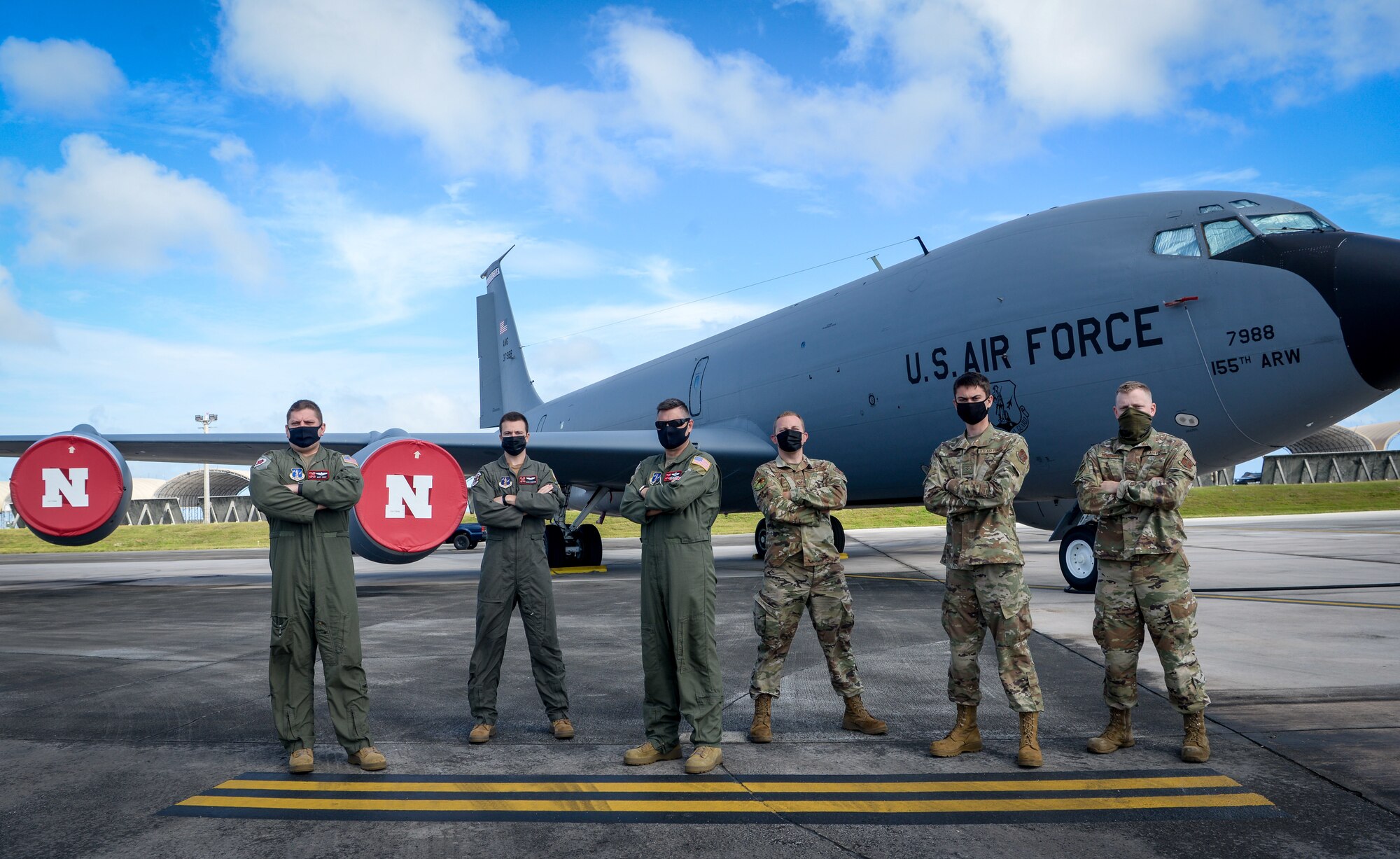 Five U.S. Air Force Guardsmen from the 155th Air Refueling Squadron, Nebraska Air National Guard, and one Guardsman from the Alaska ANG on Andersen Air Force Base, Guam, March 18, 2021. The crew, assigned to the 506th Expeditionary Aerial Refueling Squadron, assisted in rescuing five men overdue from a fishing trip.