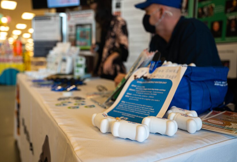 Pet waste removal bags are displayed on a table.