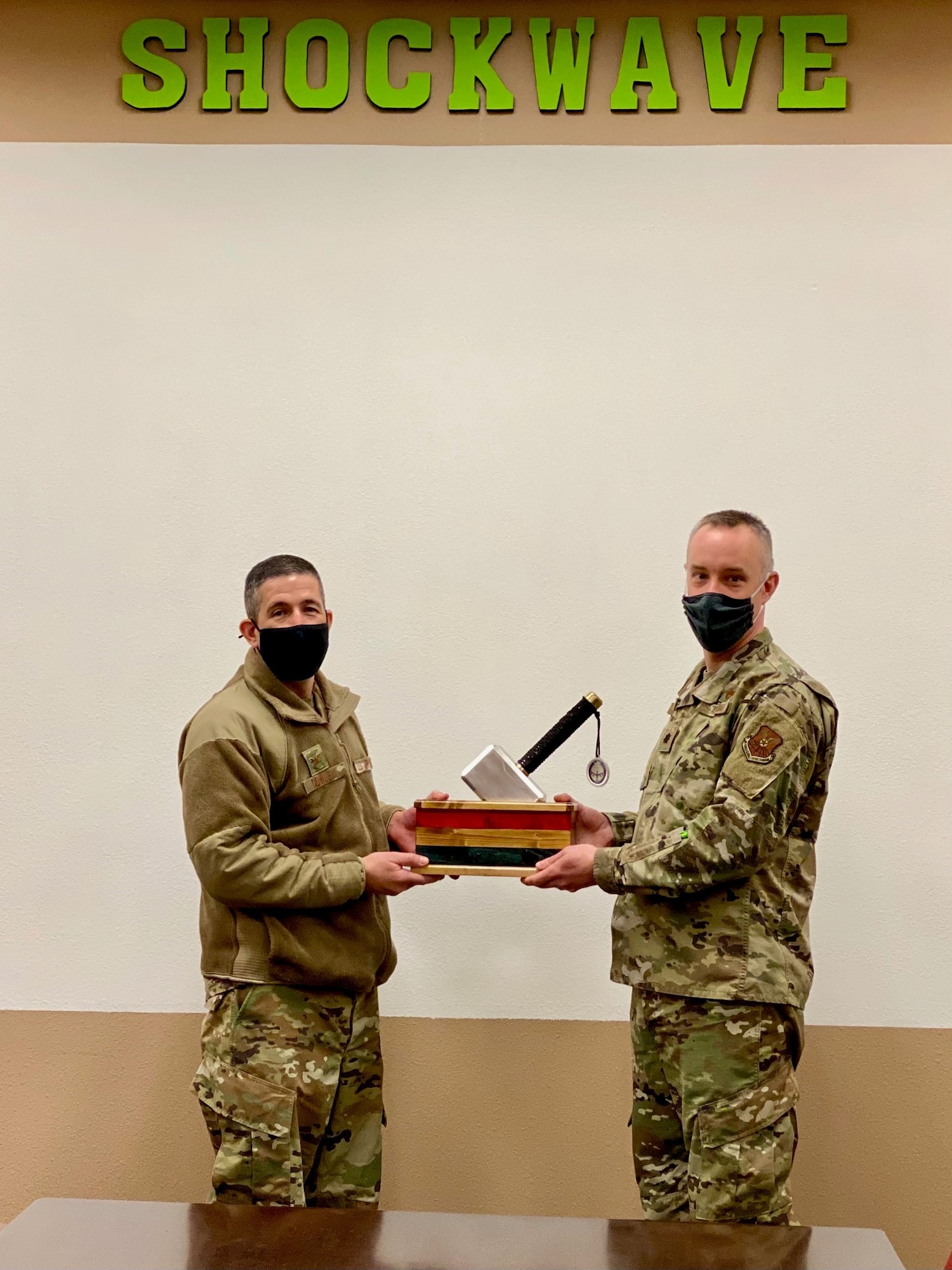 Col Aaron Cowley presents the MPoY Spirit Award to Lt. Col. Ken Howell, commander of the 705 MUNS.