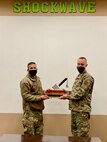 Col Aaron Cowley presents the MPoY Spirit Award to Lt. Col. Ken Howell, commander of the 705 MUNS.