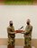 Col Aaron Cowley presents the MPoY Spirit Award to Lt. Col. Ken Howell, commander of the 705 MUNS.