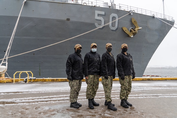 JOINT EXPEDITIONARY BASE LITTLE CREEK, Va. (Jan. 28, 2021) - Cmdr. Kathryn Wijnaldum,  commanding officer of the Harpers Ferry-class dock landing ship USS Oak Hill (LSD 51), Cmdr. LaDonna Simpson, commanding officer of the Harpers Ferry-class dock landing ship USS Carter Hall (LSD 50), Cmdr. Kimberly Jones, commanding officer of the Whidbey Island-class dock landing ship USS Tortuga, and Cmdr. Kristel O'Canas, commanding officer of the Whidbey Island-class dock landing ship USS Whidbey Island (LSD 41) pose for a photo in front of Carter Hall, Jan. 28, 2021.