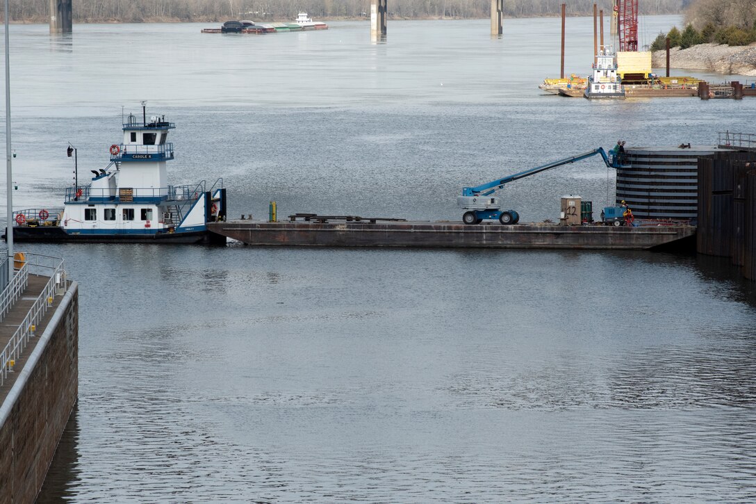 A construction crew with Johnson Brothers Construction perform spot welds March 22, 2021 on a steel sheet pile on the completed cofferdam at the Kentucky Lock Addition Project on the Tennessee River in Grand Rivers, Kentucky. The U.S. Army Corps of Engineers Nashville District is constructing a new 110-foot by 1,200-foot navigation lock at the Tennessee Valley Authority project. (USACE Photo by Lee Roberts)