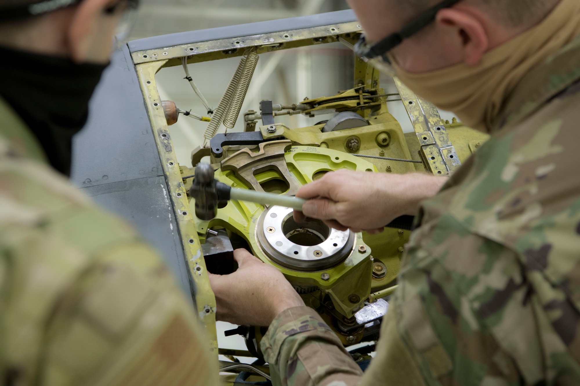Staff Sgt. Brandon Matthews, 434th Maintenance Squadron metals technician, replaces the rolling pins within the boom of a KC-135R Stratotanker, March 13, 2021, Grissom Air Reserve Base, Indiana. The aircraft was receiving maintenance overall, because the controlling equipment was unable to lower itself down far enough to meet the receiving aircraft. (U.S. Air Force photo by Staff Sgt. Alexa Culbert)