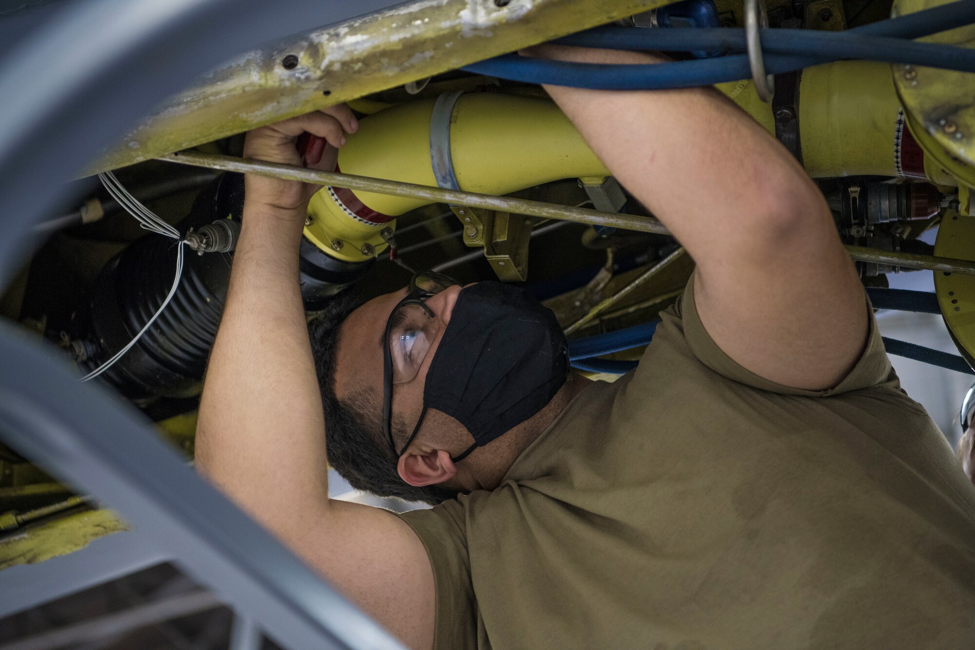 Staff Sgt. Jonah Rodriguez, 434thAircraft Maintenance Squadron hydraulic system technicians, repair the boom on a KC-135R Stratotanker, March 13, 2012, Grissom Air Reserve Base, Indiana. The KC-135R Stratotanker is responsible for mid-flight refueling and aiding the Air Force in its Global Reach and Global Power missions. (U.S. Air Force photo by Staff Sgt. Alexa Culbert)