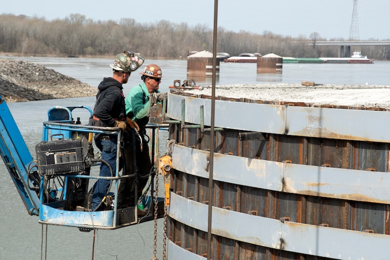 A construction crew with Johnson Brothers Construction perform spot welds March 22, 2021 on a steel sheet pile on the completed cofferdam at the Kentucky Lock Addition Project on the Tennessee River in Grand Rivers, Kentucky. The U.S. Army Corps of Engineers Nashville District is constructing a new 110-foot by 1,200-foot navigation lock at the Tennessee Valley Authority project. (USACE Photo by Lee Roberts)