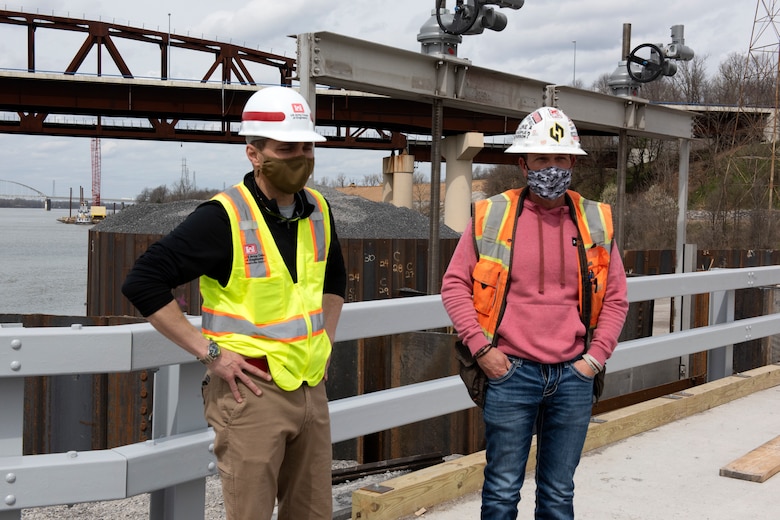 Jeremiah Manning (Left), resident engineer with the U.S. Army Corps of Engineers Nashville District, talks with Jamie Willcutt, construction manager for Johnson Brothers Construction, while standing on top of the completed cofferdam at the Kentucky Lock Addition Project March 22, 2021 on the Tennessee River in Grand Rivers, Kentucky. The U.S. Army Corps of Engineers Nashville District is constructing a new 110-foot by 1,200-foot navigation lock at the Tennessee Valley Authority project. (USACE Photo by Lee Roberts)