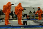 Michigan National Guardsmen conduct decontamination procedures during Northern Exposure 21 in Mount Pleasant, Mich., March 16, 2021.