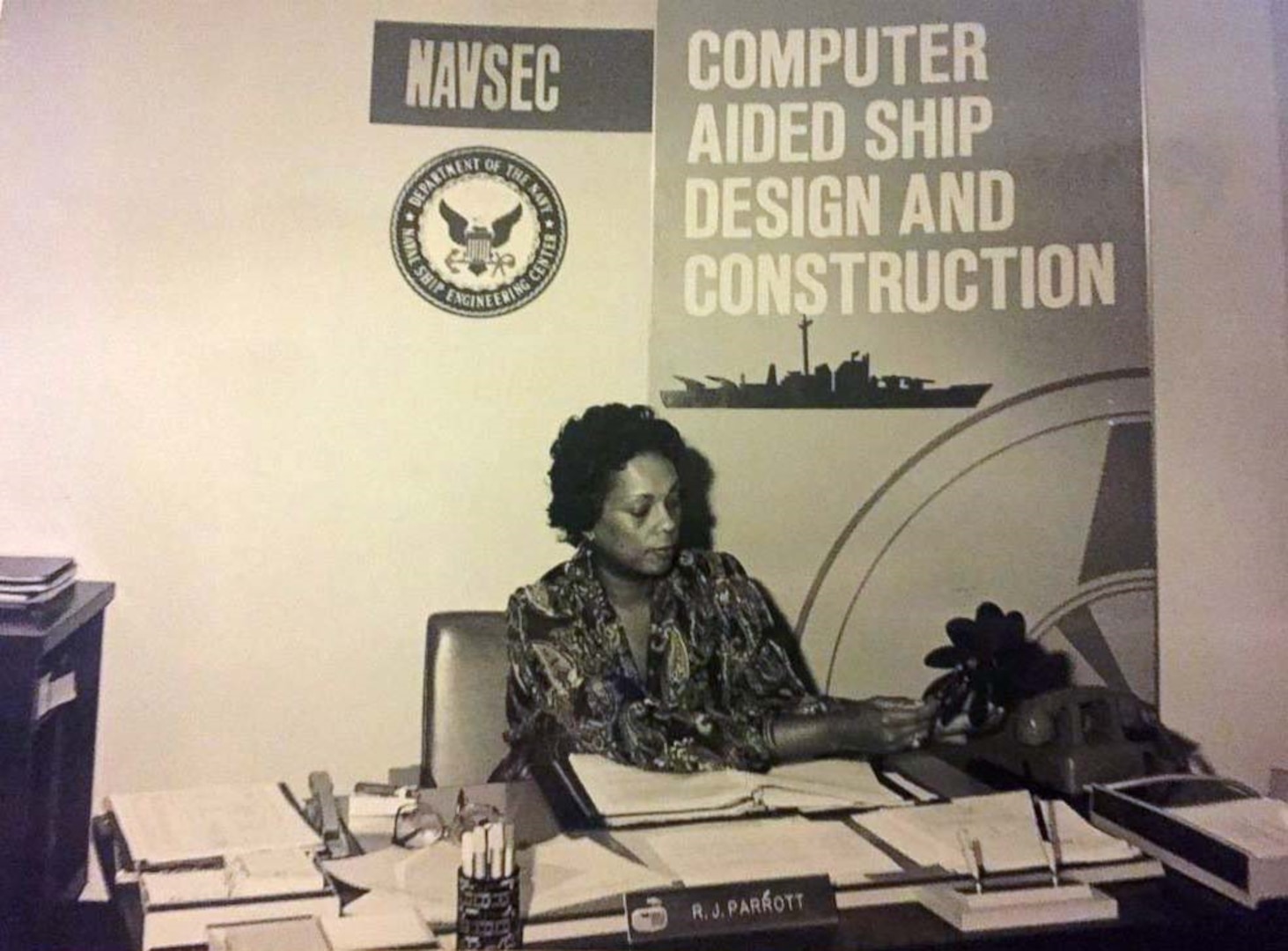 Raye Montague at her desk.