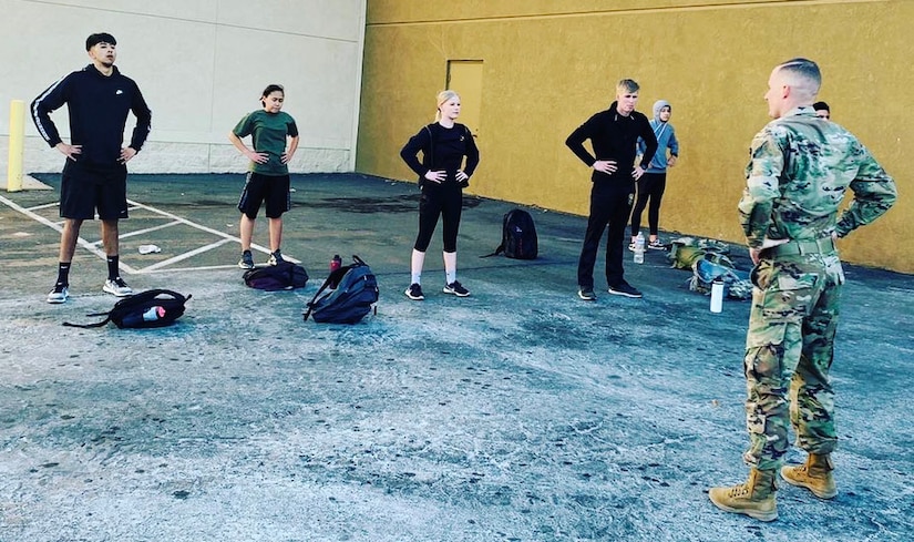 Staff Sgt. Ryan Skorker, right, leads Hesperia, Calif. Future Soldiers in physical fitness routines near the local recruiting station in March, 2021.