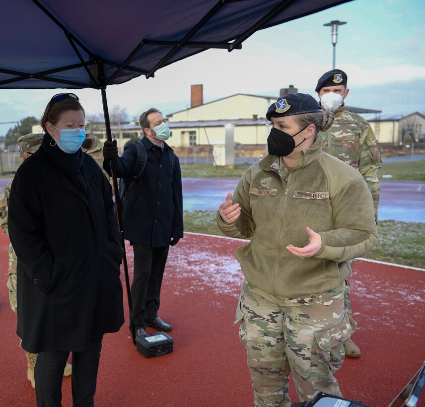 U.S. Air Force Staff Sergeant Briana Aston, 52nd Fighter Wing Security Forces Squadron antiterrorism specialist (right), briefs Erin Sawyer, the new senior foreign policy advisor to the commander of United States Air Forces Europe and Air Forces Africa (left), on the Small Unmanned Aerial System, or sUAS, at Spangdahlem Air Base, Germany, March 19, 2021.