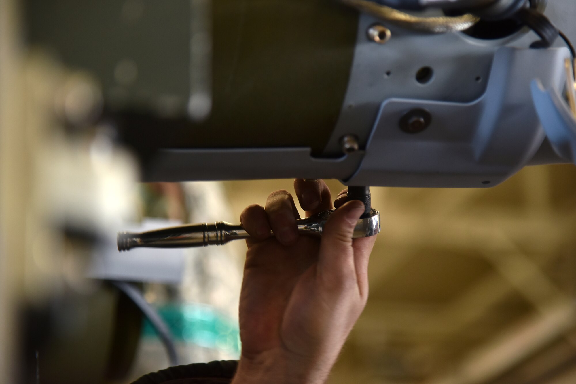 Tech. Sgt. Anthony Beard, 8th Maintenance Squadron conventional maintenance production supervisor, attaches a tail kit on a munition during a routine training event at Kunsan Air Base, Republic of Korea, March 24, 2021. The 8th MXS “Dragons” build and maintain munitions for the 8th Fighter Wing. (U.S. Air Force photo by Senior Airman Suzie Plotnikov)
