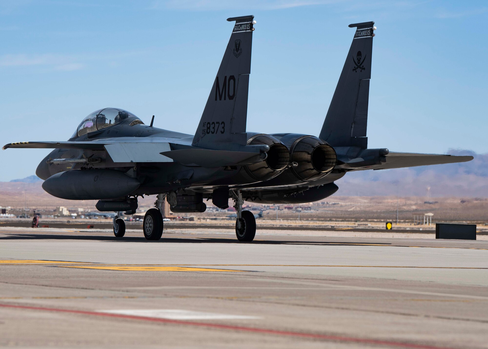 A fighter jet taxis down the flightline