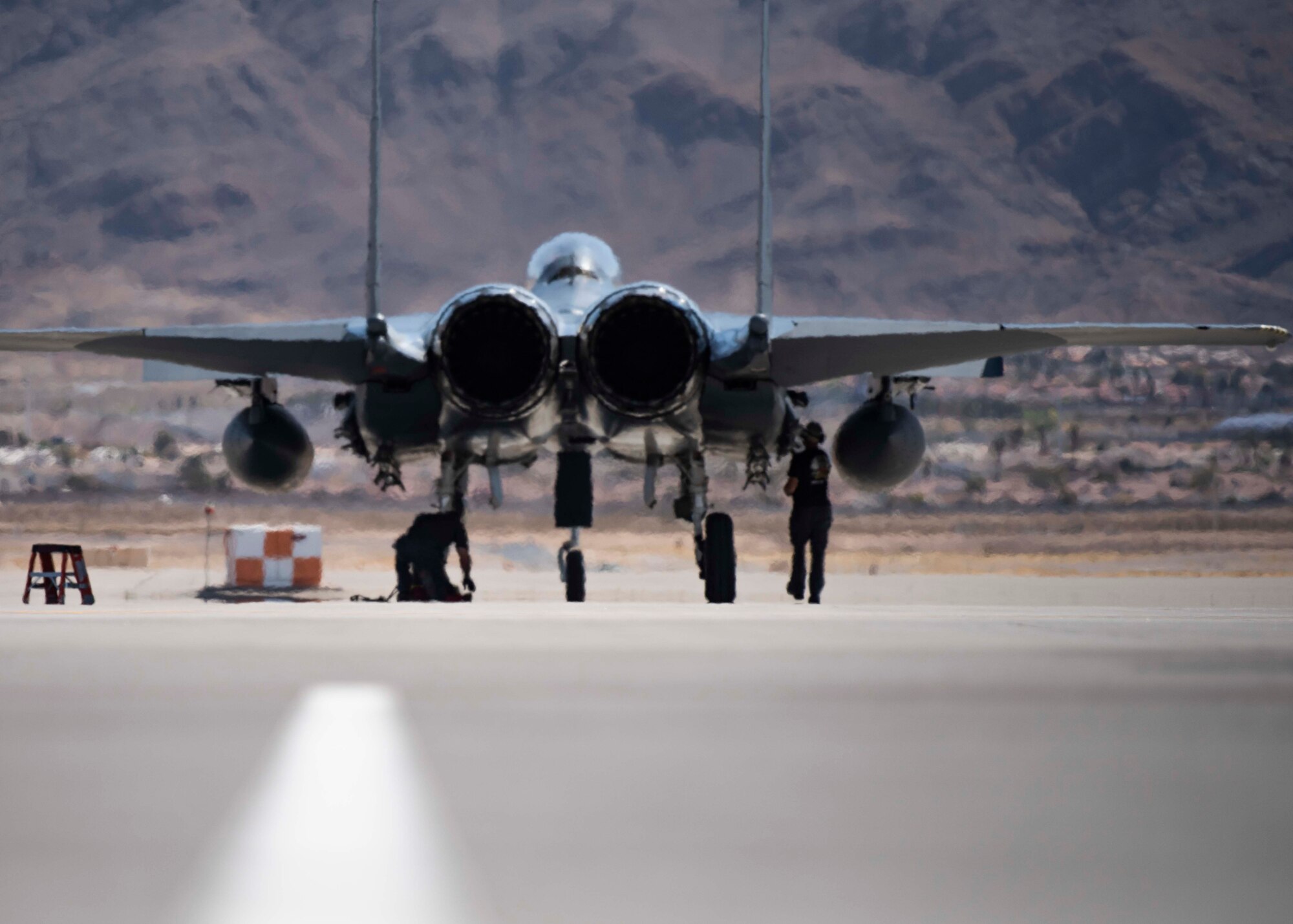 A fighter jet sits on the flightline