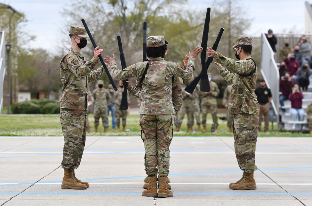 Members of the 338th Training Squadron’s freestyle drill team perform during the 81st Training Group drill down on the Levitow Training Support Facility drill pad at Keesler Air Force Base, Miss., March 19, 2021. The drill down is part of a quarterly open-ranks inspection, regulation drill routine and freestyle drill routine. Keesler AFB trains more than 30,000 students each year. While in training, Airmen are given the opportunity to volunteer to learn and execute drill-down routines.