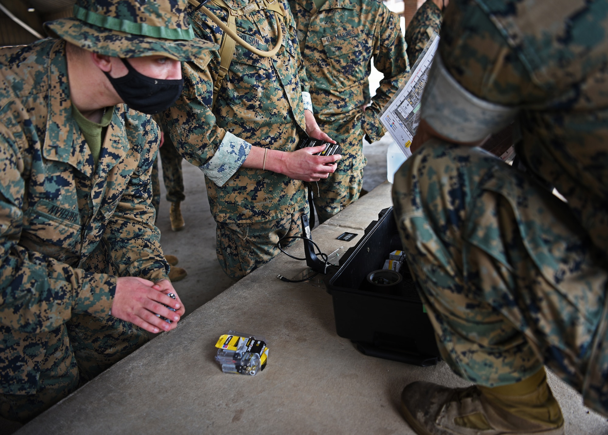 U.S. Marine Corps Tactical Signals Intelligence Operator course students from the Marine Corps Detachment, prepare intelligence equipment for a field exercise outside of the MCD dormitories on Goodfellow Air Force Base, Texas, March 22, 2021. This field training was designed to deliver technically proficient, combat capable Marines to operating forces and supporting establishments. (U.S. Air Force photo by Senior Airman Abbey Rieves)