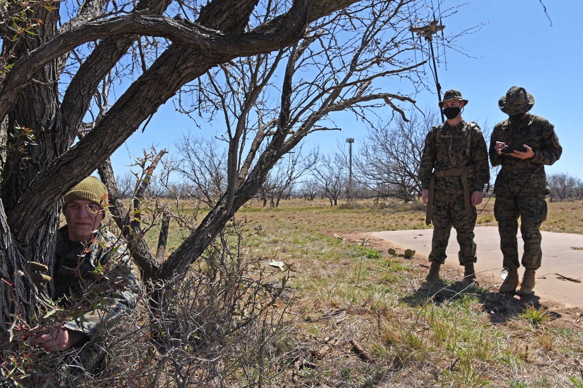 U.S. Marine Corps Tactical Signals Intelligence Operator course students from the Marine Corps Detachment, successfully locate Lance Cpl. Dylan Benedict, MCD TSOC course student, during an intelligence field exercise outside of the MCD dormitories on Goodfellow Air Force Base, Texas, March 23, 2021.  Benedict was tracked by radio frequency, intelligence, and GPS coordinates. (U.S. Air Force photo by Senior Airman Abbey Rieves)