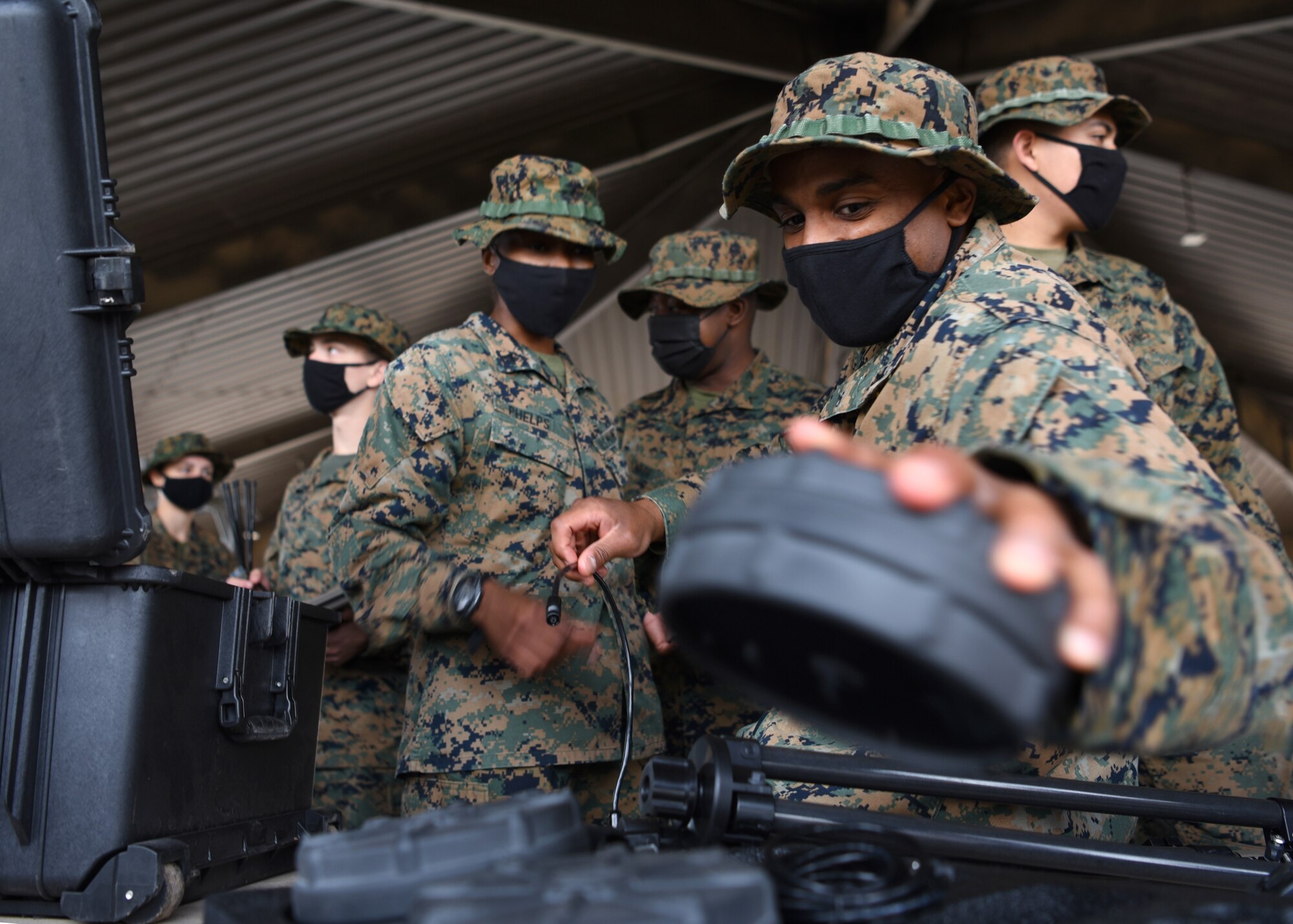 U.S. Marine Corps Lance Cpl. Kristopher Wilkes, Marine Corps Detachment Tactical Signals Intelligence Operator course student stores away a component of the THiEF intelligence device after completing a field exercise outside of the MCD dormitories on Goodfellow Air Force Base, Texas, March 22, 2021. During the outdoor exercise, students were integrated into a simulated battlefield environment and used various intelligence devices to practice intercepting enemy radio signals.  (U.S. Air Force photo by Senior Airman Abbey Rieves)