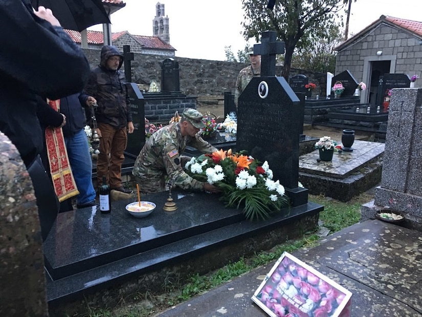 Maj. Gen. John Gronski places a wreath at the grave of Medal of Honor recipient Sgt. James Mestrovich Nov. 1 at St. John Serbian Orthodox Church, Durasevici, Montenegro. Mestrovich was born in the village, immigrated to the U.S. immediately before WWI and served with distinction in the 28th Division, which Gronski formerly commanded. Mestrovich was killed one week before the armistice of Nov. 11, 1918. (U.S. Army National Guard courtesy photo)