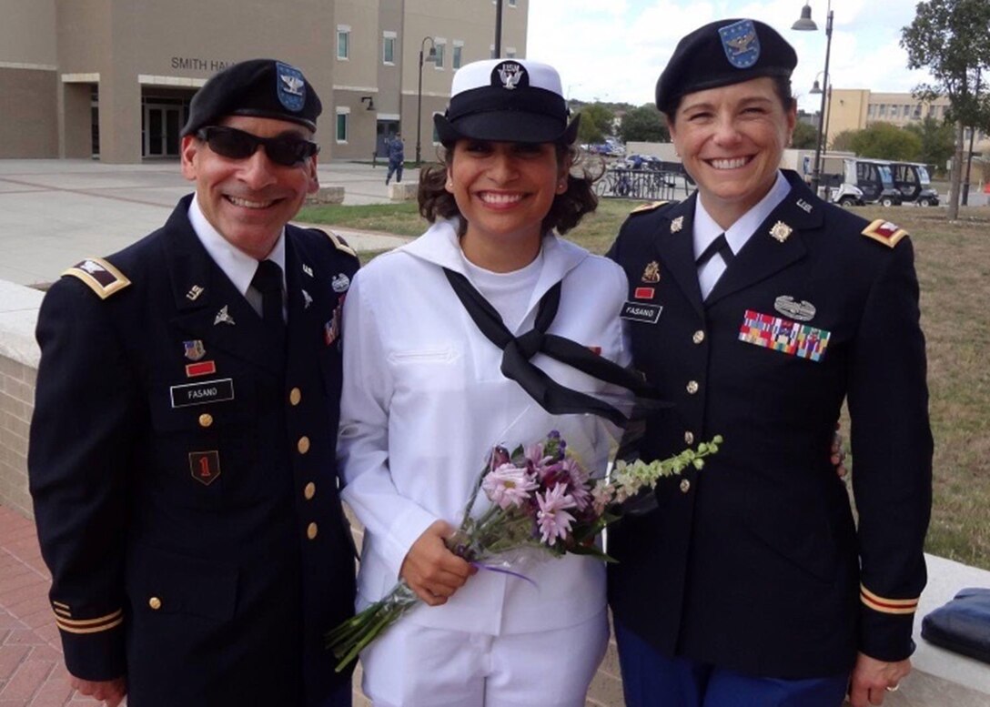 Then-Col. Cheryn L. Fasano (right), now brigadier general and the deputy commander of the 377th Theater Sustainment Command, poses with her stepdaughter Navy Seaman Gabriella Fasano and her husband Col. John Fasano after her the seaman's graduation from Navy boot camp.