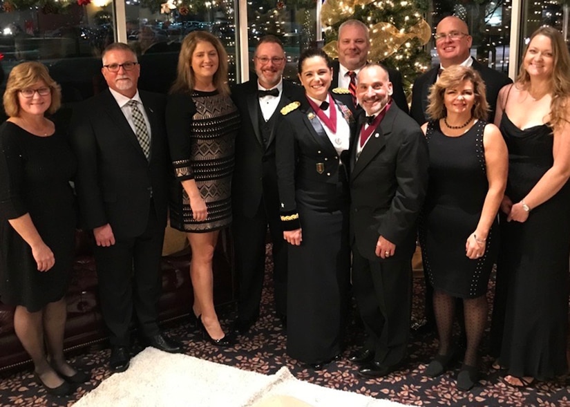 Army Reserve Brig. Gen. Cheryn L. Fasano stands front and center with her husband, retired Army Col. John Fasano, and her classmates from the Indiana University-Purdue University Reserve Officer Training Corps program, and their spouses.