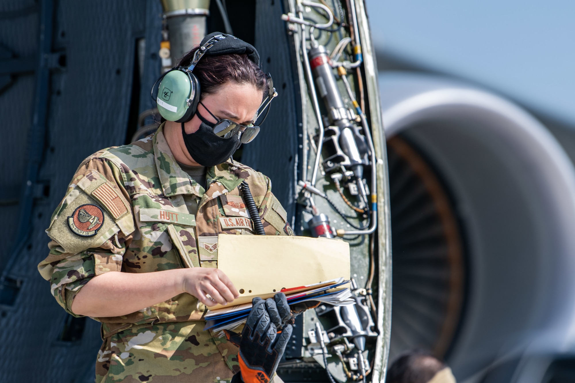 Senior Airman Rachael Hutt, 9th Airlift Squadron loadmaster, reads a manual during loadmaster training at Dover Air Force Base, Delaware, March 9, 2021. Loadmasters from the 9th Airlift Squadron participated in the training as part of a Major Command Service Tail Trainer initiative driven by Air Mobility Command. The training expedites C-5 loadmaster upgrade training, enabling Dover AFB to provide rapid global airlift. (U.S. Air Force photo by Senior Airman Christopher Quail)