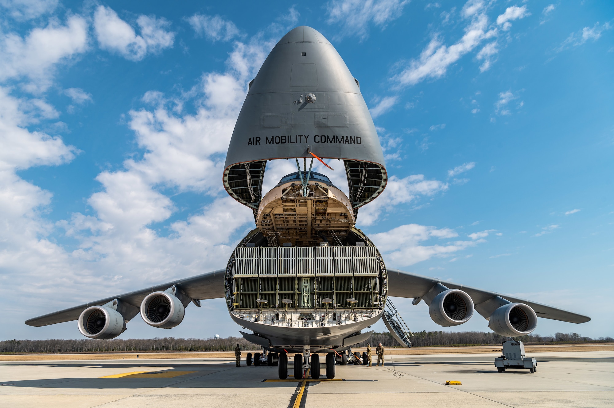 Loadmasters from the 9th Airlift Squadron prepare a C-5M Super Galaxy for loadmaster training at Dover Air Force Base, Delaware, March 9, 2021. Loadmasters from the 9th Airlift Squadron participated in the training as part of a Major Command Service Tail Trainer initiative driven by Air Mobility Command. The training expedites C-5 loadmaster upgrade training, enabling Dover AFB to provide rapid global airlift. (U.S. Air Force photo by Senior Airman Christopher Quail)